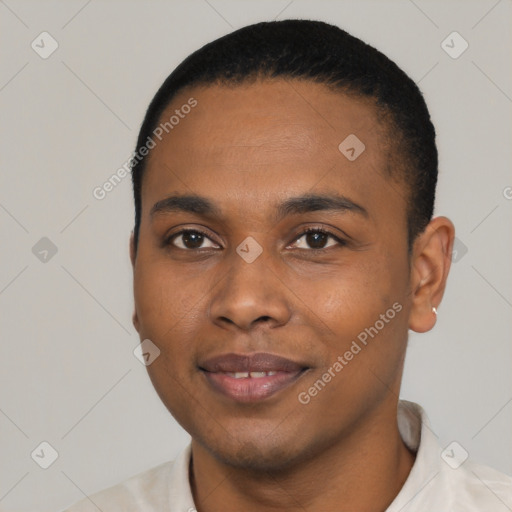 Joyful black young-adult male with short  black hair and brown eyes