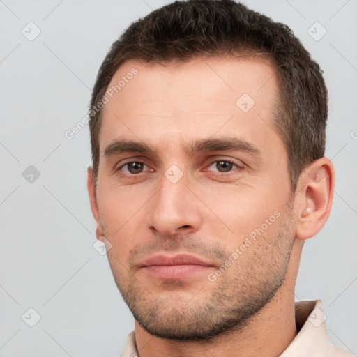 Neutral white young-adult male with short  brown hair and brown eyes