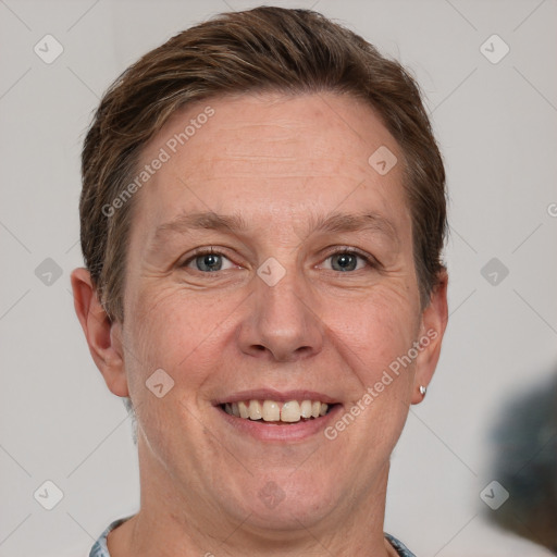 Joyful white adult female with short  brown hair and grey eyes