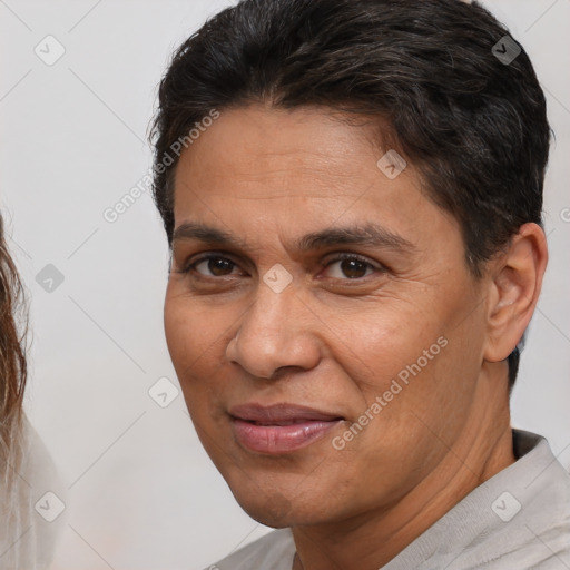 Joyful white adult male with short  brown hair and brown eyes