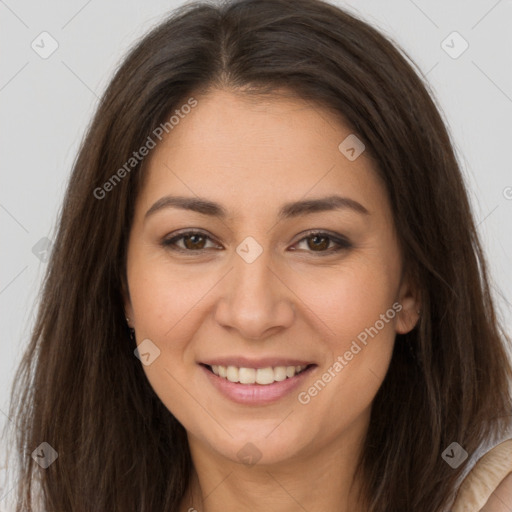 Joyful white young-adult female with long  brown hair and brown eyes