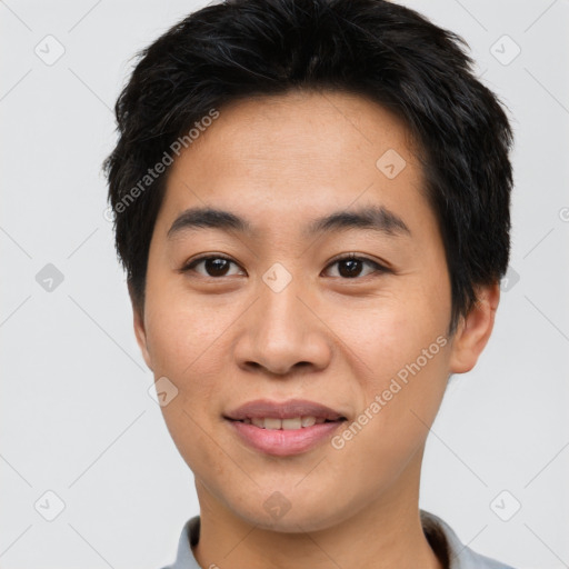 Joyful asian young-adult male with short  brown hair and brown eyes