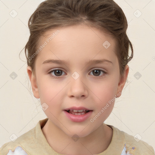 Joyful white child female with short  brown hair and brown eyes