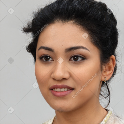 Joyful latino young-adult female with medium  brown hair and brown eyes