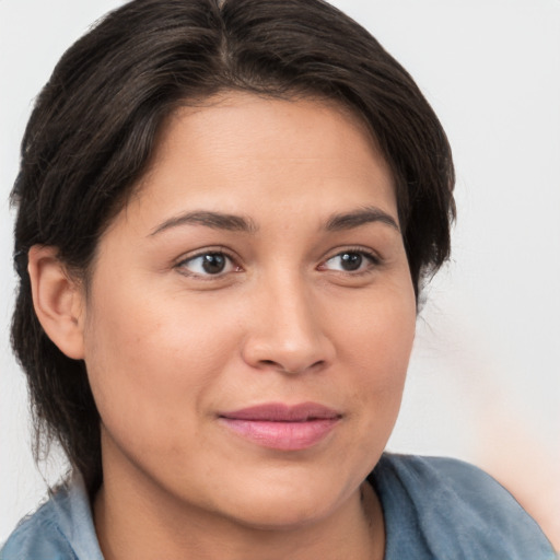 Joyful white young-adult female with medium  brown hair and brown eyes