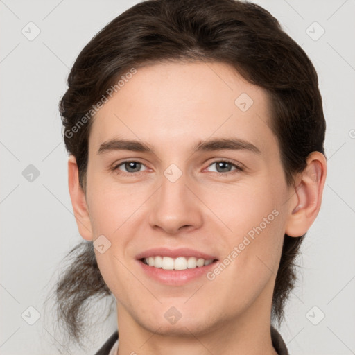 Joyful white young-adult male with medium  brown hair and brown eyes