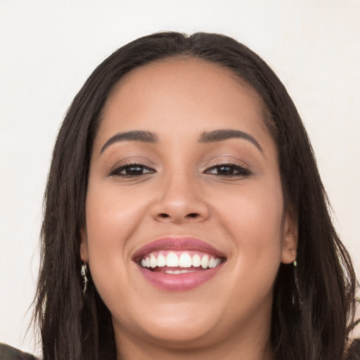 Joyful white young-adult female with long  black hair and brown eyes