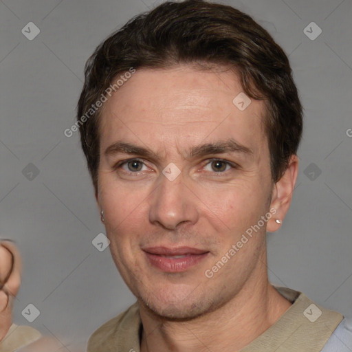 Joyful white adult male with short  brown hair and grey eyes