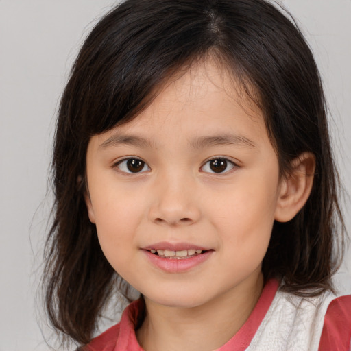 Joyful white child female with medium  brown hair and brown eyes