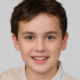 Joyful white child male with short  brown hair and brown eyes