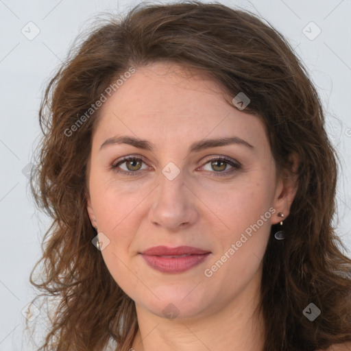 Joyful white adult female with long  brown hair and brown eyes