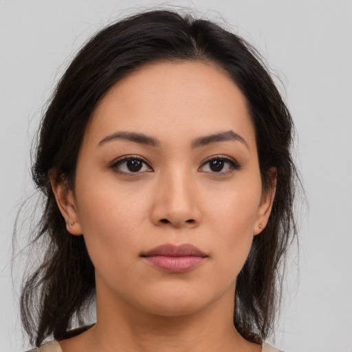 Neutral latino young-adult female with medium  brown hair and brown eyes
