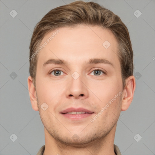 Joyful white young-adult male with short  brown hair and grey eyes