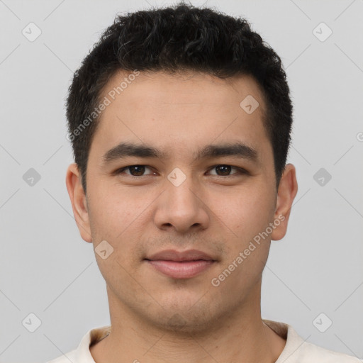 Joyful latino young-adult male with short  brown hair and brown eyes