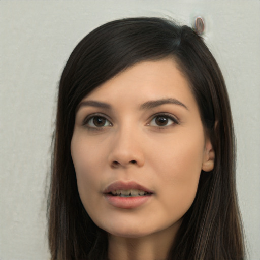 Joyful asian young-adult female with long  brown hair and brown eyes