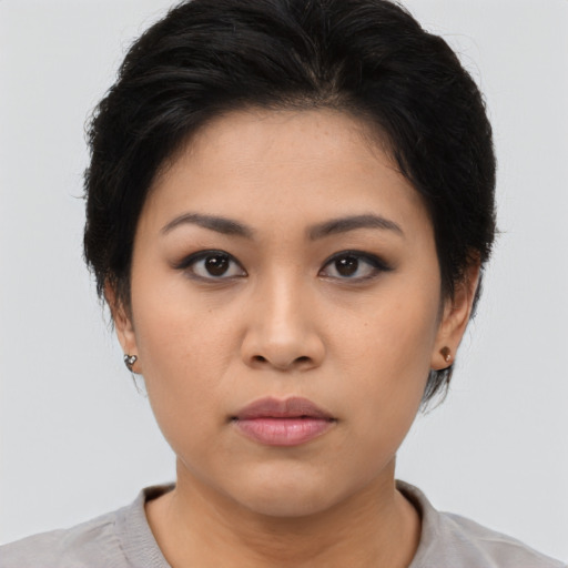 Neutral asian young-adult female with medium  brown hair and brown eyes