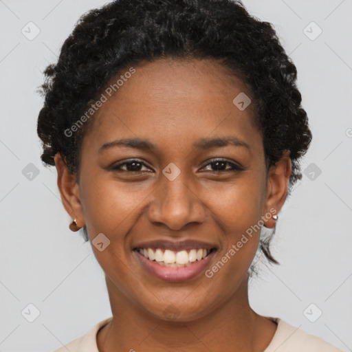 Joyful black young-adult female with short  brown hair and brown eyes