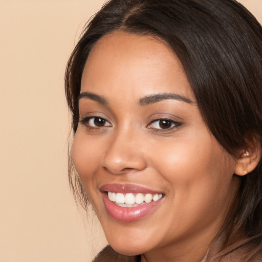 Joyful white young-adult female with medium  brown hair and brown eyes