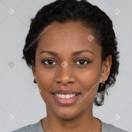 Joyful black young-adult female with short  black hair and brown eyes