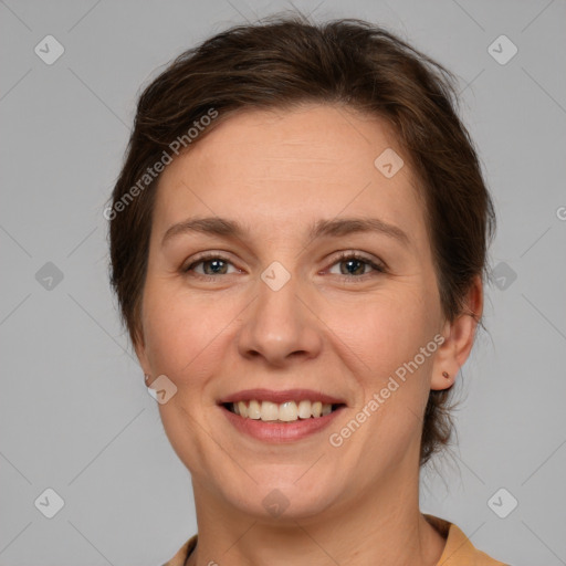 Joyful white adult female with medium  brown hair and brown eyes