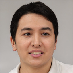 Joyful asian young-adult male with short  black hair and brown eyes