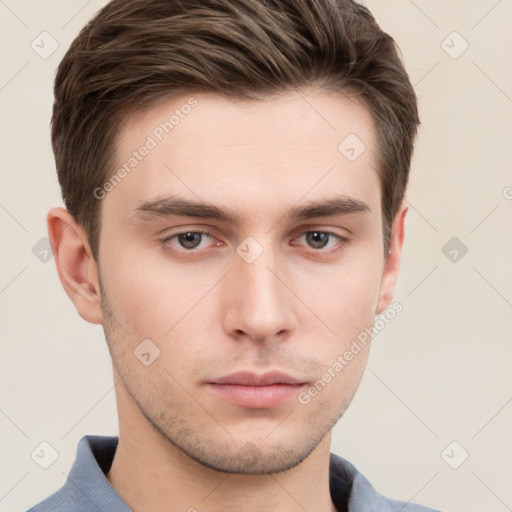 Neutral white young-adult male with short  brown hair and grey eyes