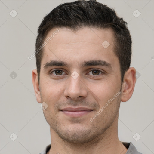 Joyful white young-adult male with short  brown hair and brown eyes