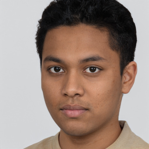 Neutral latino young-adult male with short  black hair and brown eyes