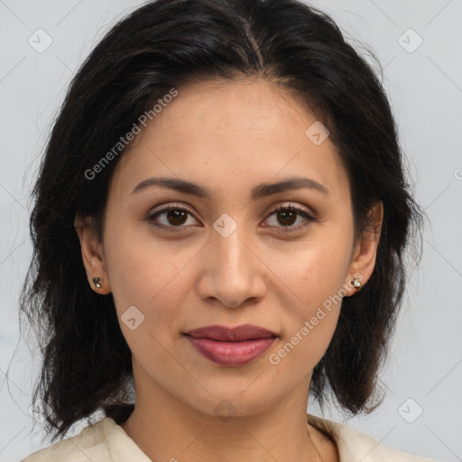 Joyful latino young-adult female with medium  brown hair and brown eyes