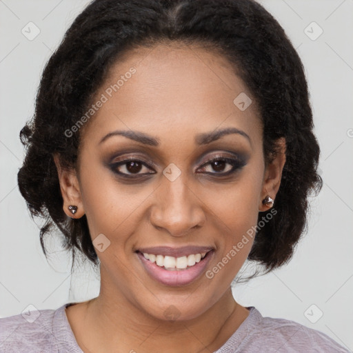 Joyful black young-adult female with medium  brown hair and brown eyes