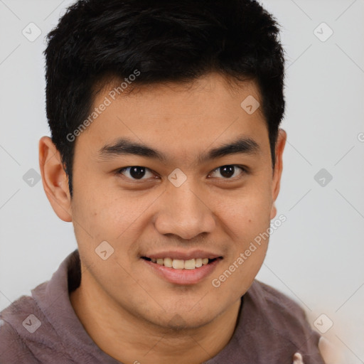 Joyful asian young-adult male with short  brown hair and brown eyes