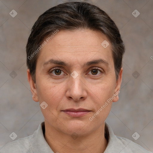 Joyful white adult female with short  brown hair and brown eyes