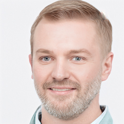 Joyful white adult male with short  brown hair and blue eyes