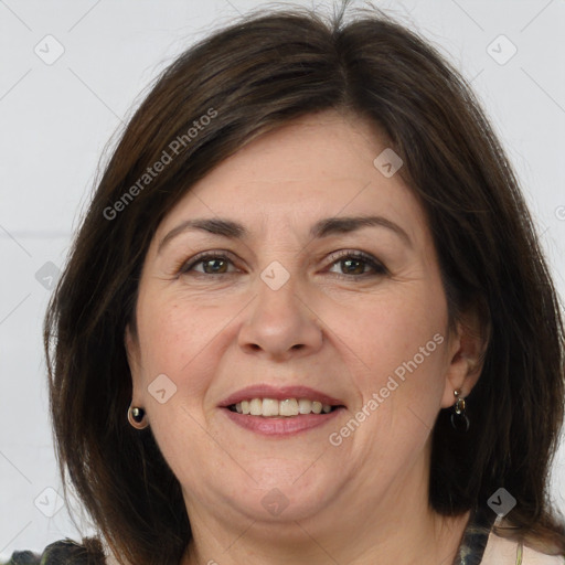 Joyful white adult female with medium  brown hair and brown eyes