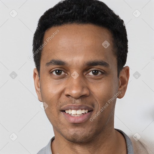 Joyful black young-adult male with short  black hair and brown eyes