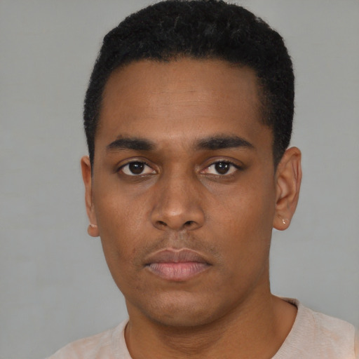 Neutral black young-adult male with short  black hair and brown eyes