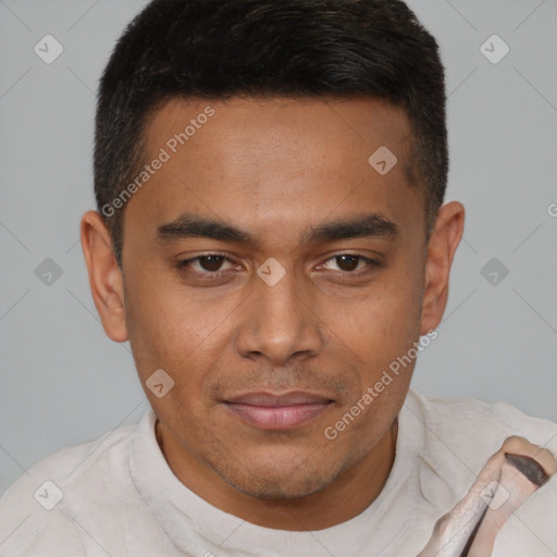 Joyful latino young-adult male with short  brown hair and brown eyes