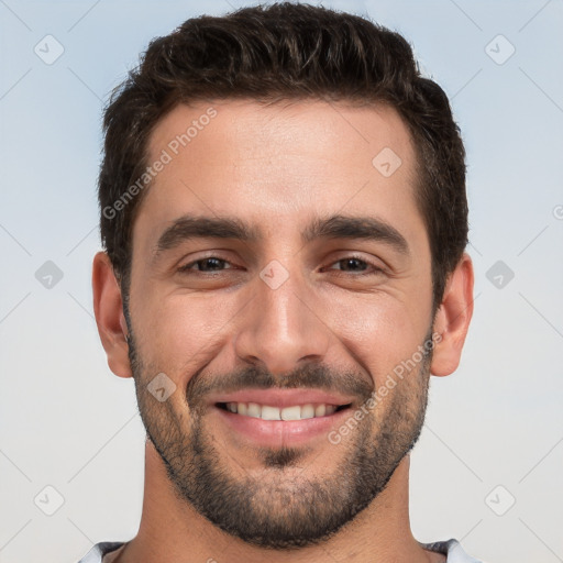 Joyful white young-adult male with short  black hair and brown eyes