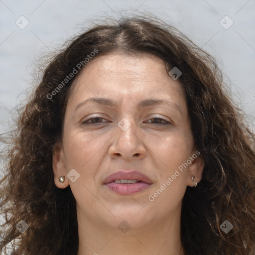 Joyful white adult female with long  brown hair and brown eyes