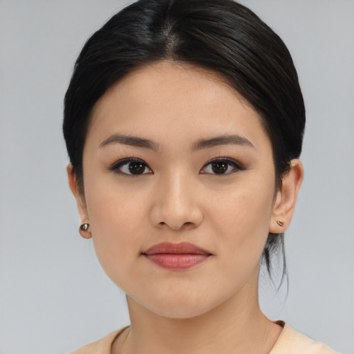 Joyful white young-adult female with medium  black hair and brown eyes