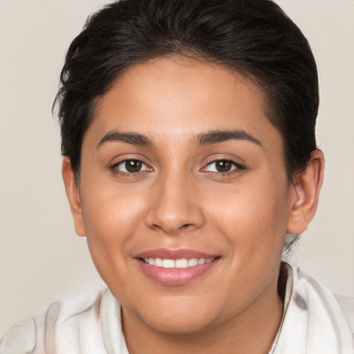 Joyful white young-adult female with short  brown hair and brown eyes