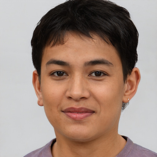 Joyful asian young-adult female with short  brown hair and brown eyes