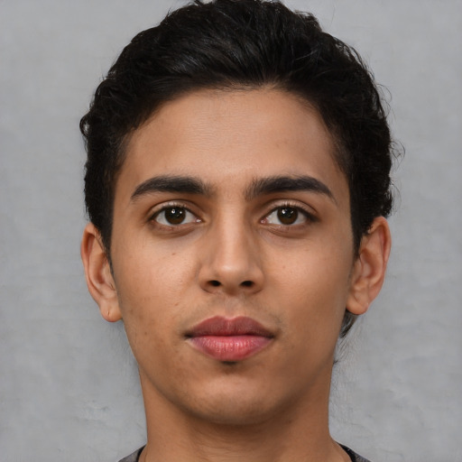 Neutral latino young-adult male with short  brown hair and brown eyes
