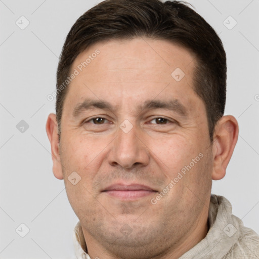 Joyful white adult male with short  brown hair and brown eyes