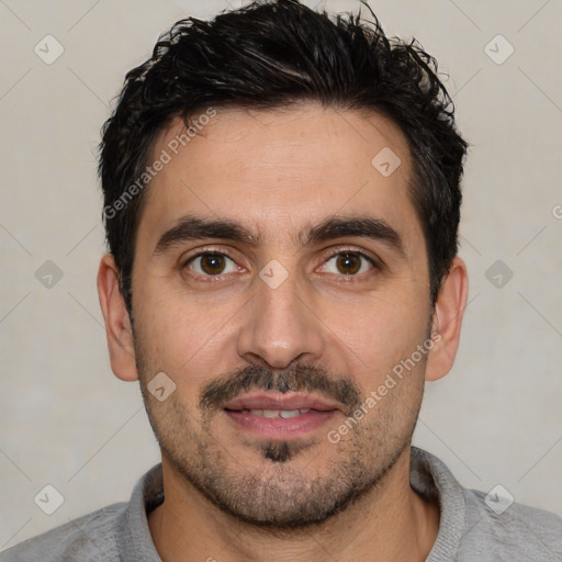 Joyful white young-adult male with short  black hair and brown eyes