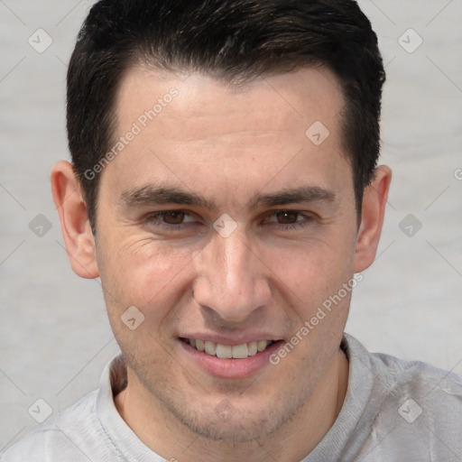 Joyful white adult male with short  brown hair and brown eyes