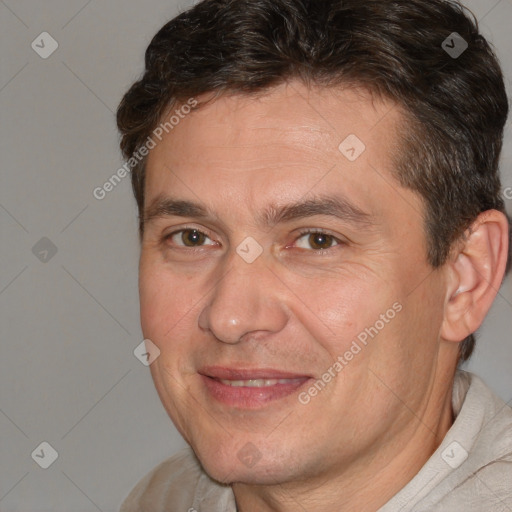 Joyful white adult male with short  brown hair and brown eyes