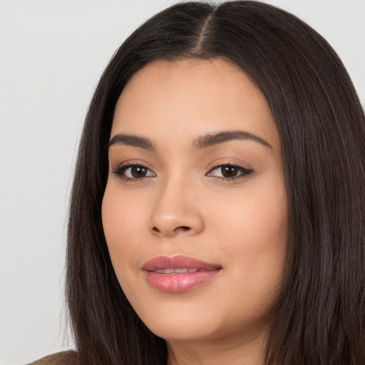 Joyful white young-adult female with long  black hair and brown eyes