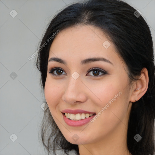 Joyful asian young-adult female with long  brown hair and brown eyes