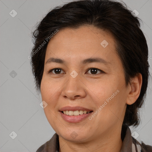 Joyful white adult female with medium  brown hair and brown eyes